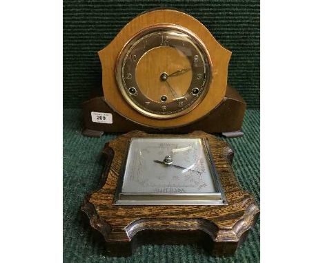 A walnut cased Bentima mantel clock and a oak cased barometer 