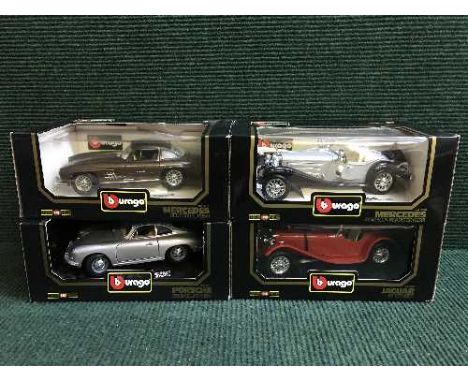 Four boxed Burago large scale die cast vehicles  