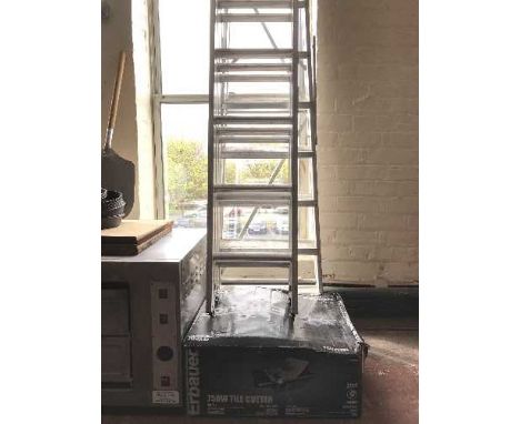 An aluminium extension ladder, set of steps, patio awning and an Erbaurer tile cutter 