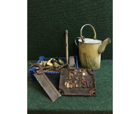 A basket of assorted hand tools, vintage tins, field glasses, cast iron plate F.P. 7 3/4 yards SW and an aluminum watering ca