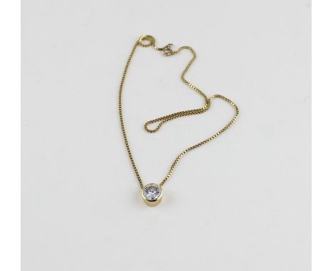 A yellow metal and solitaire diamond pendant choker necklace,&nbsp;bezel set round cut diamond, (diamond weight approx. 2 car