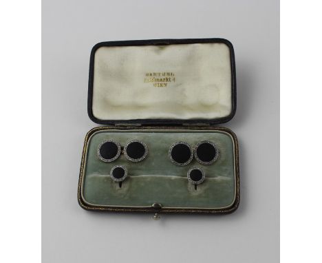 A cased Austrian 14ct. yellow, and white gold and diamond gentleman's dress set, comprising a pair of cuff links and pair of 