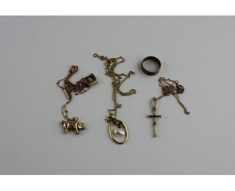 A yellow metal cross, fashioned as a stylised Ankh, (yellow metal assessed as 14ct. gold, suspended from a fine 14ct. gold ov