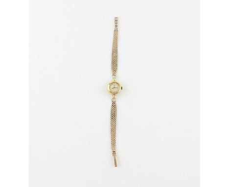 An 18ct. yellow gold Omega Ladymatic ladies' bracelet watch, manual wind, having circular enamel dial with raised gold baton 