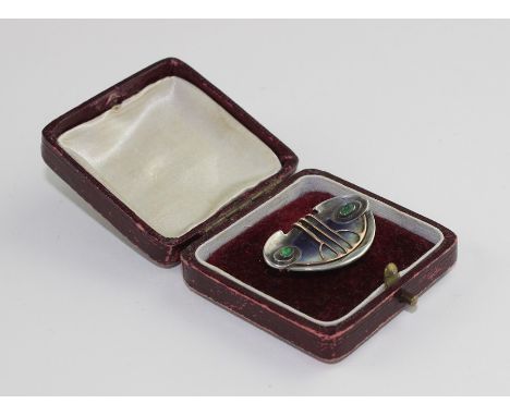 A Murrle Bennett & Co Art Nouveau silver, 9ct. gold and emerald set brooch, c.1900, having shaped and dished silver mount wit