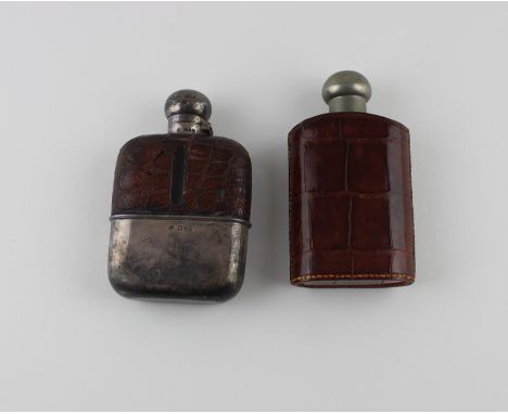 A silver mounted and crocodile skin bound glass hip flask, by William Hutton &amp; Sons Ltd, assayed London 1901-2, with pull