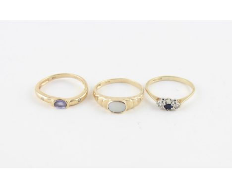 A 14ct. yellow gold, lilac-blue tanzanite and diamond ring,&nbsp;the centre set oval cut lilac-blue tanzanite with burnish se