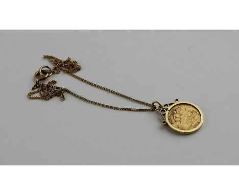 A 1913 George V gold half sovereign, London mint, within 9ct. gold scroll top circular pendant mount, this assayed Birmingham