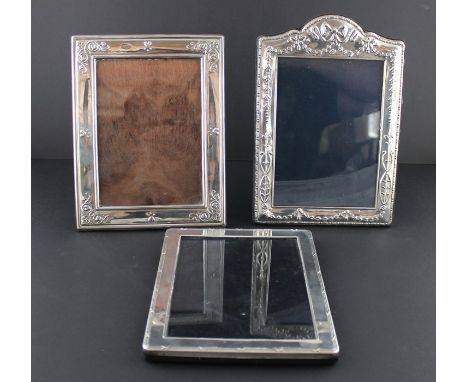 A contemporary silver rectangular photograph frame, by Whitehill Silver &amp; Plate Co, assayed Sheffield 1992, having arched