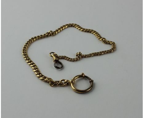 A yellow metal flat curb link chain, indistinct marks, (yellow metal assessed as 18ct. gold), length 31.5cm. (27.8g)