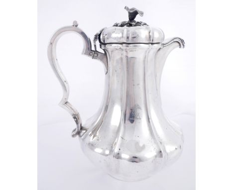 A William IV Irish silver water jug, by Richard Sawyer, jr.The flower-shaped finial on moulded, domed, hinged lid, over mould