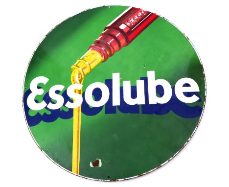 1930s Essolube pictorial enamel advertising sign.The circular metal sign, the green background with picture of oil pouring fr