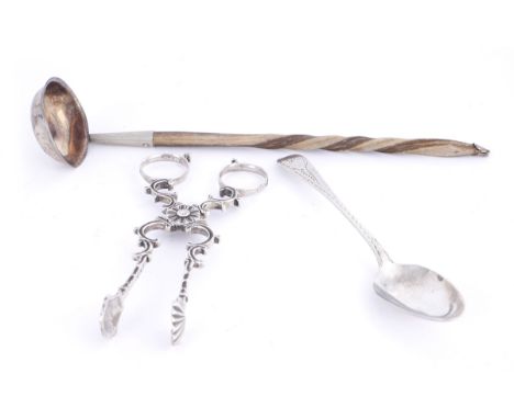 George II Irish silver sugar nips, George III Irish silver toddy ladle and a Cork silver teaspoon.The sugar-nips of scrolling