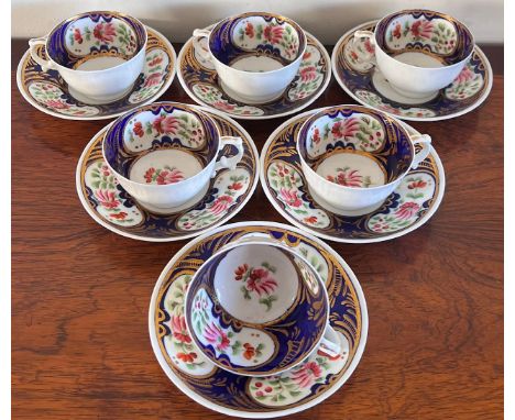 SIX DECORATIVE POLYCHROME CUPS AND SAUCERS