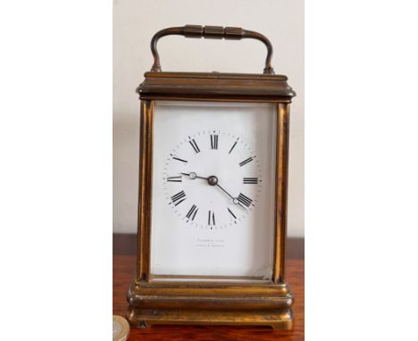 BRASS CARRIAGE CLOCK BY EDWARD &amp; SONS, PARIS, LONDON, GLASGOW, HOUR BUTTON
WORKING, CLOCK MOVEMENT NEEDS ATTENTION
