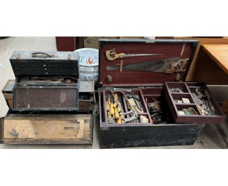 A pine tool trunk together with two other tool trunks containing woodworking and other tools 