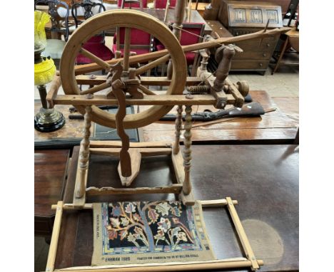 A spinning wheel together with a tapestry and frame 