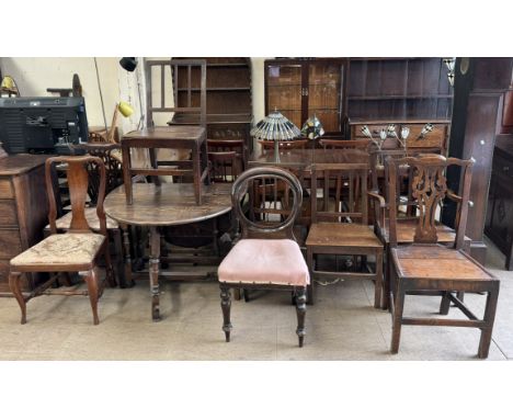 A gateleg dining table with an oval top on turned legs together with a matched set of four 19th century stick back chairs, tw