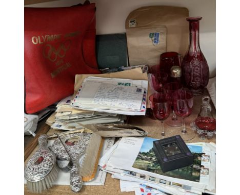 A flash glass decanter together with cranberry glass drinking glasses, assorted envelopes, part dressing table set, Olympic G