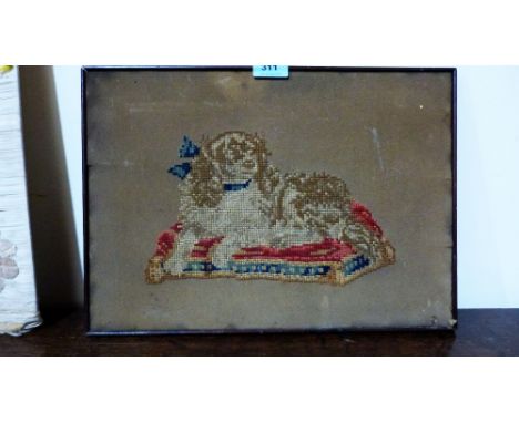 A Victorian tapestry, spaniel on a cushion. 12'' x 16''