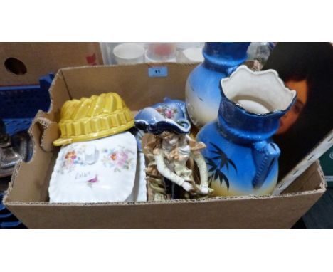 Miscellaneous ceramics with an unframed portrait