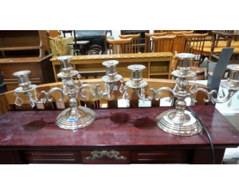 A pair of plated three light candelabra hung with prismatic drops
