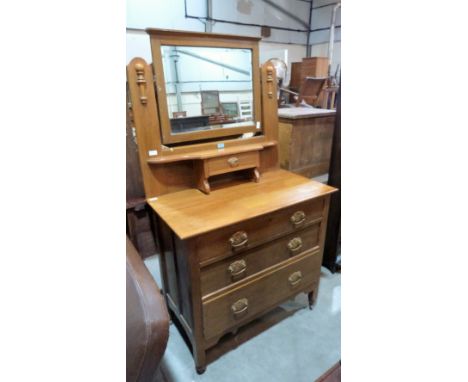 An Edward VII light oak dressing chest with three long drawers. 36'' wide