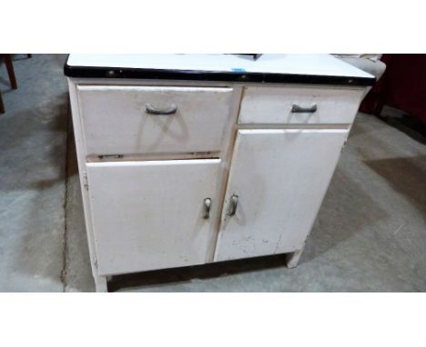 A 1950's painted kitchen cabinet with enamel top. 34'' wide