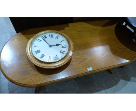 A modern wall clock and a coffee table