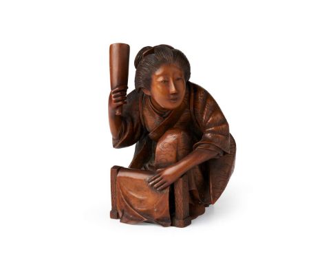 CARVED BOXWOOD OKIMONO OF A LAUNDRESS MEIJI PERIOD, BY MASANORI KAWAKITA (ACTIVE 19TH CENTURY) 明治 正則川北款 木雕洗衣婦置物depicting a l