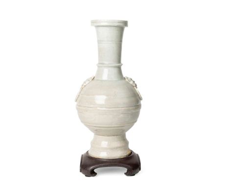  QINGBAI TAOTIE-MASK HANDLED RIBBED VASE SONG DYNASTY 宋 青白瓷鋪首銜環弦紋瓶 帶木座of archaistic bronze hu form, the ribbed body flanked w