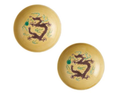  PAIR OF YELLOW-GROUND AUBERGINE-AND GREEN ENAMELLED 'DRAGON' SAUCERS TONGZHI MARK 同治款 黃地紫綠彩五爪龍戲珠紋碟（一對）incised and enamelled 