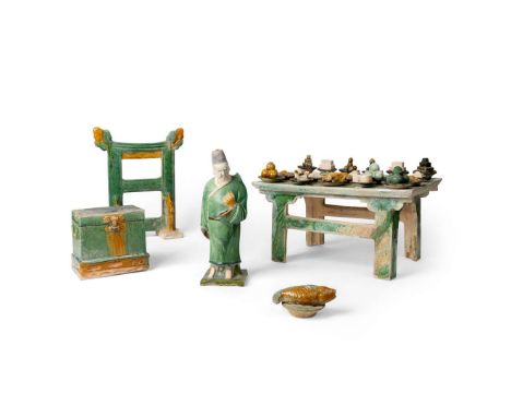  GROUP OF FIVE SANCAI WARES MING DYNASTY 明 三彩男俑、供桌、魚供盤、衣箱及衣架（共五件）comprising: a standing male guardian figure; an offering tab