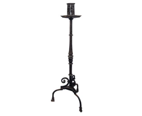 Candlestick with three feet in wrought iron. Spanish work. 16th century.Height: 138 cm.