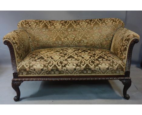An early 19th century acanthus carved oak two seater sofa, raised on scrolling cabriole feet, H.79 W.142 D.74cm 