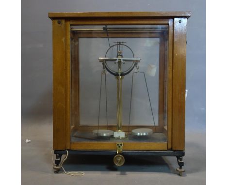 A set of vintage weighing scales with slate base, in glass case, H.54 W.43 D.28cm 