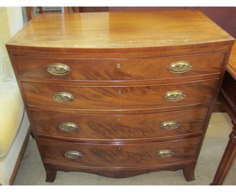 A George III mahogany chest with a D shaped top and four drawers on splayed bracket feet   