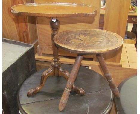 A 20th century mahogany wine table with a shell carved lobed rectangular top on a tapering column and learn carved tripod bas