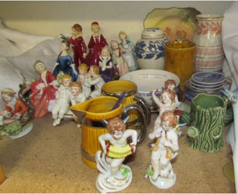 A pair of Royal Worcester figures of boys on a bench together with assorted continental cherub figures, Royal Doulton figures