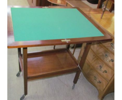 A 20th century mahogany card table / tea trolley