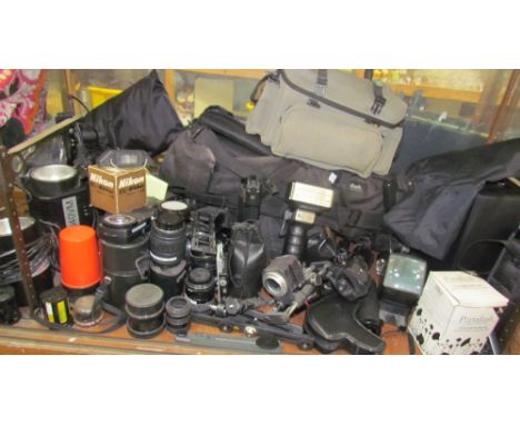 Assorted camera equipment including Portaflash equipment, lenses, flash guns etc