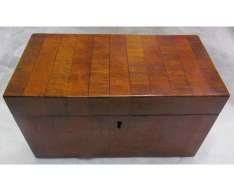 A 19th century mahogany tea caddy of rectangular form with two divisions to the interior