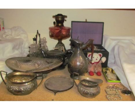 A cranberry glass oil lamp together with assorted electroplated items and costume jewellery
