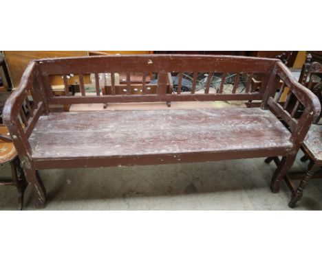 A large pine garden bench