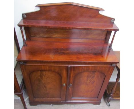 A Victorian  mahogany chiffonier, with a raised back and shelf with ring turned columns, the base with a rectangular top abov