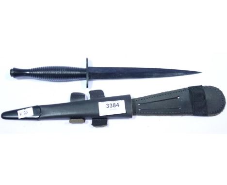 Current Issue Commando Dagger, marked with broad Arrow and Made in Sheffield, with scabbard, blade L: 18 cm. P&amp;P Group 2 