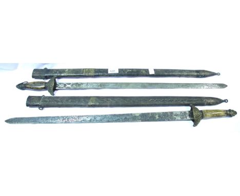 Pair of Chinese swords with heavily etched blades and stitched scabbards, blade L: 65 cm. P&amp;P Group 3 (£25+VAT for the fi