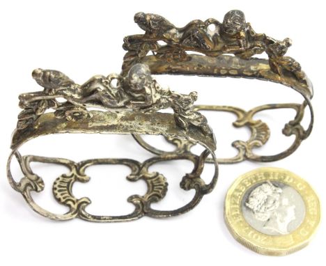 Pair of presumed silver figural napkin rings, no visible marks. Combined 30g. P&amp;P Group 1 (£14+VAT for the first lot and 