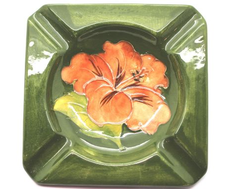 Moorcroft green ground coral hibiscus pattern ashtray, 11 x 11 cm. P&P Group 1 (£14+VAT for the first lot and £1+VAT for subs