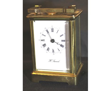 H Samuel brass carriage clock, with key, H: 11 cm. P&P Group 2 (£18+VAT for the first lot and £3+VAT for subsequent lots)Cond